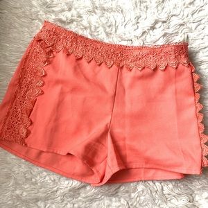 Orange low waist lace trim shorts